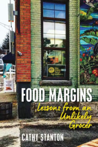 A book cover for "Food Margins" showing a brick building with signs and a mural